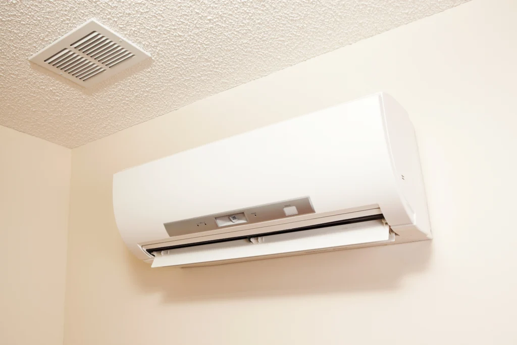 Ductless air conditioning installation on a textured ceiling near a ventilation grill in San Jose, CA.